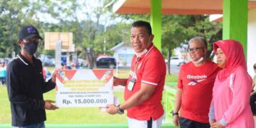 Pemkab Bolmut Gelar Olah Raga Bersama dan Berikan Santunan Pada Ahli Waris Korban Bencana Alam