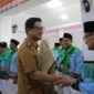 Wakil Wali Kota Kotamobagu, Rendy Virgiawan Mangkat, secara resmi melepas 48 jemaah calon haji asal Kota Kotamobagu untuk musim haji 1447 Hijriah/2026.